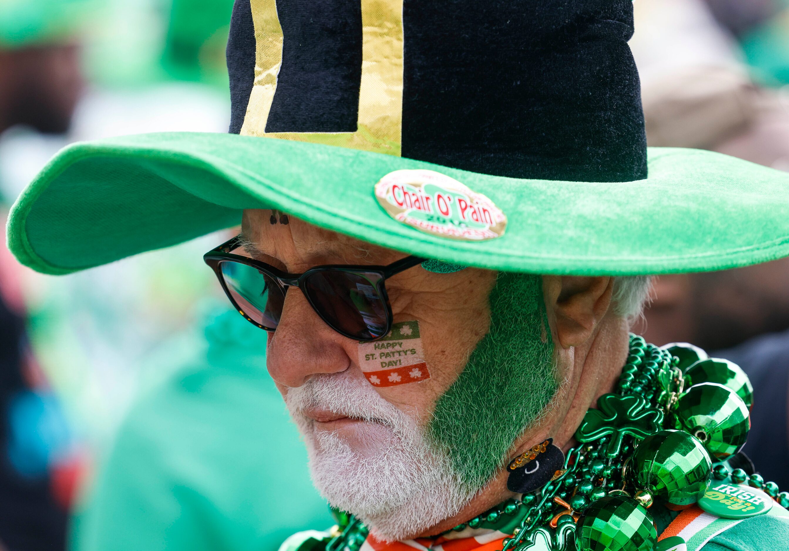 Larry Williams waits in line to get in a block party during a Saint Patrick's Day parade on...