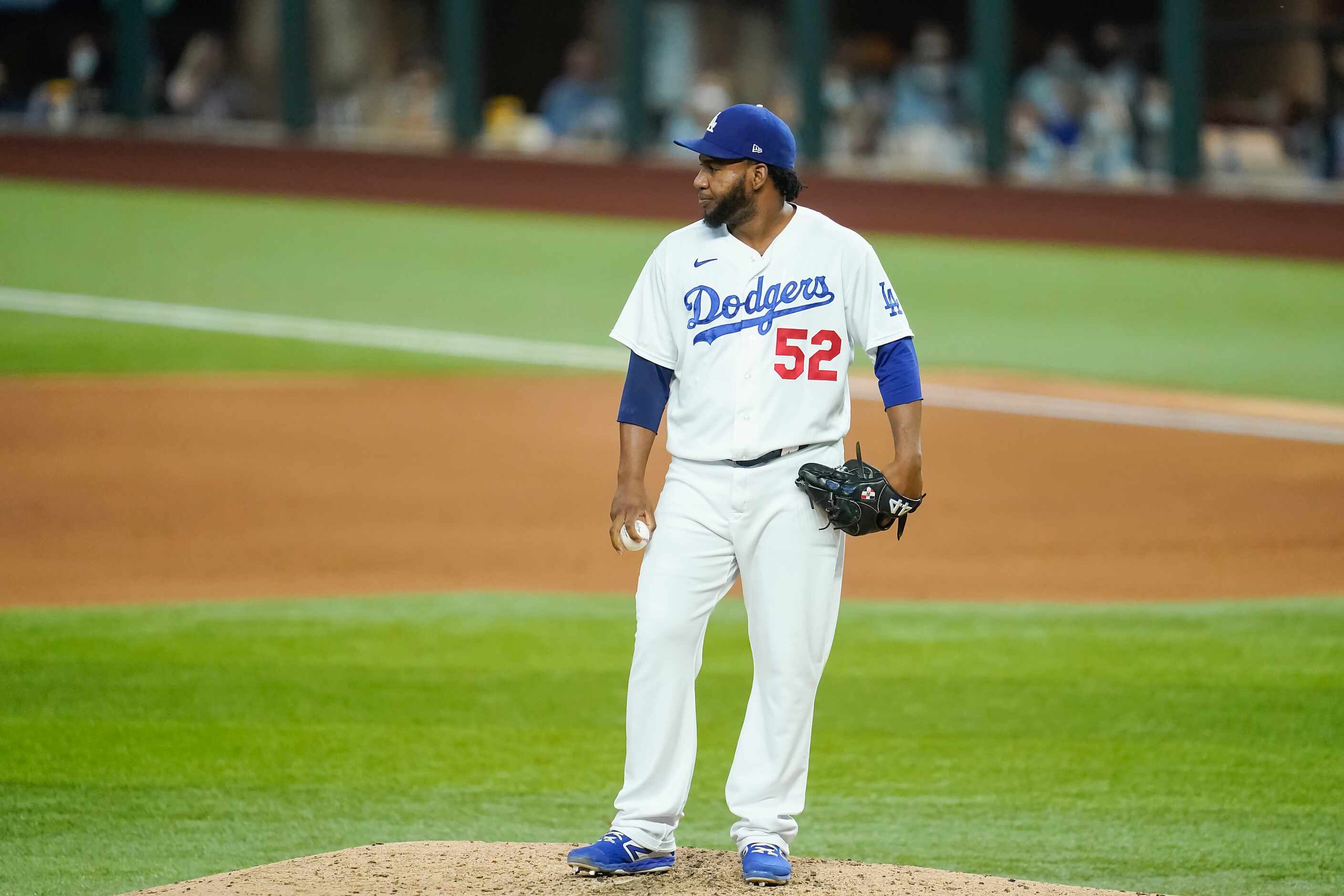 Los Angeles Dodgers relief pitcher Pedro Baez reacts after issuing a walk to load the bases...