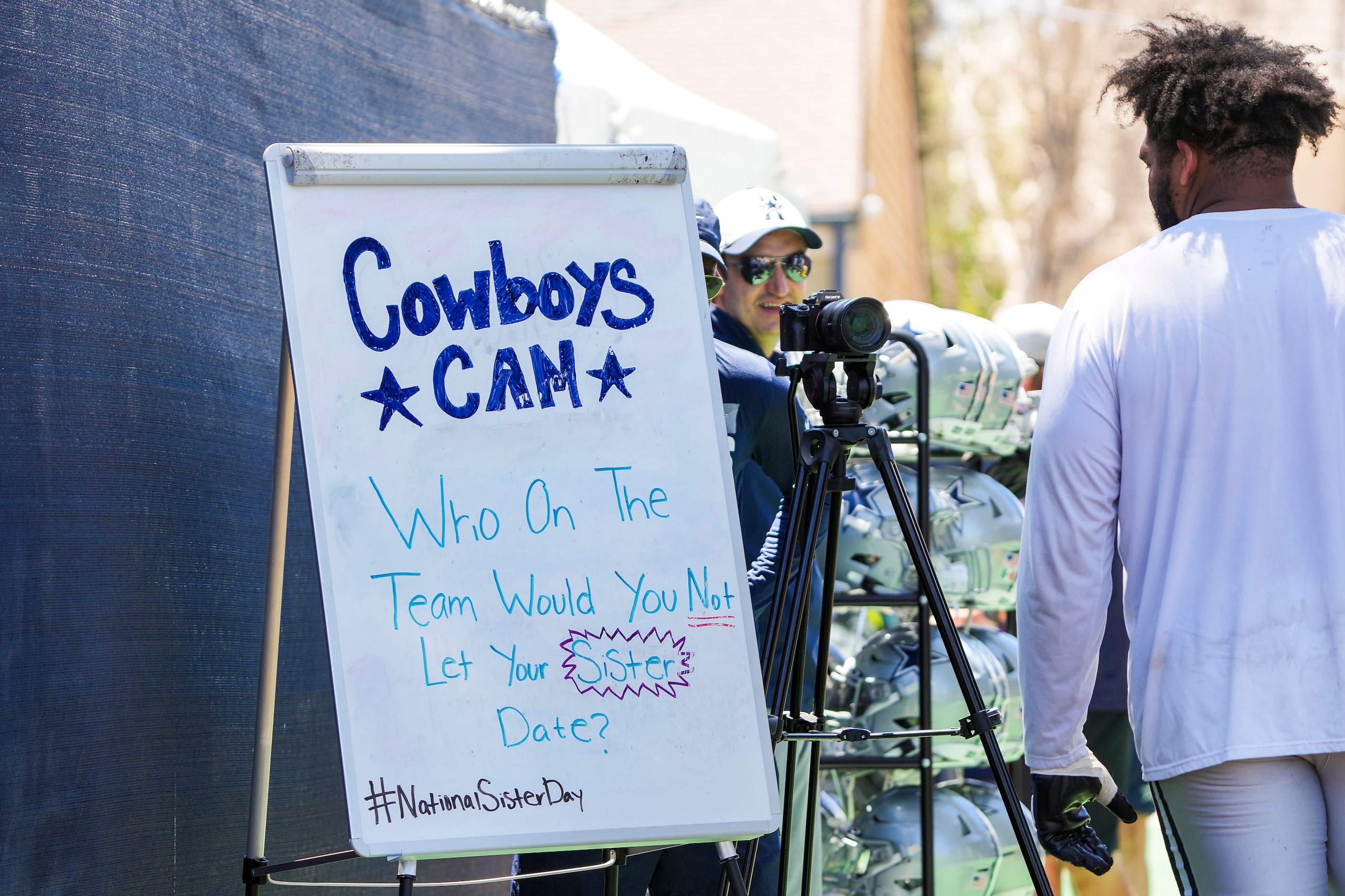 Dallas Cowboys tackle La'el Collins stops ponder a video question on his way off the field...