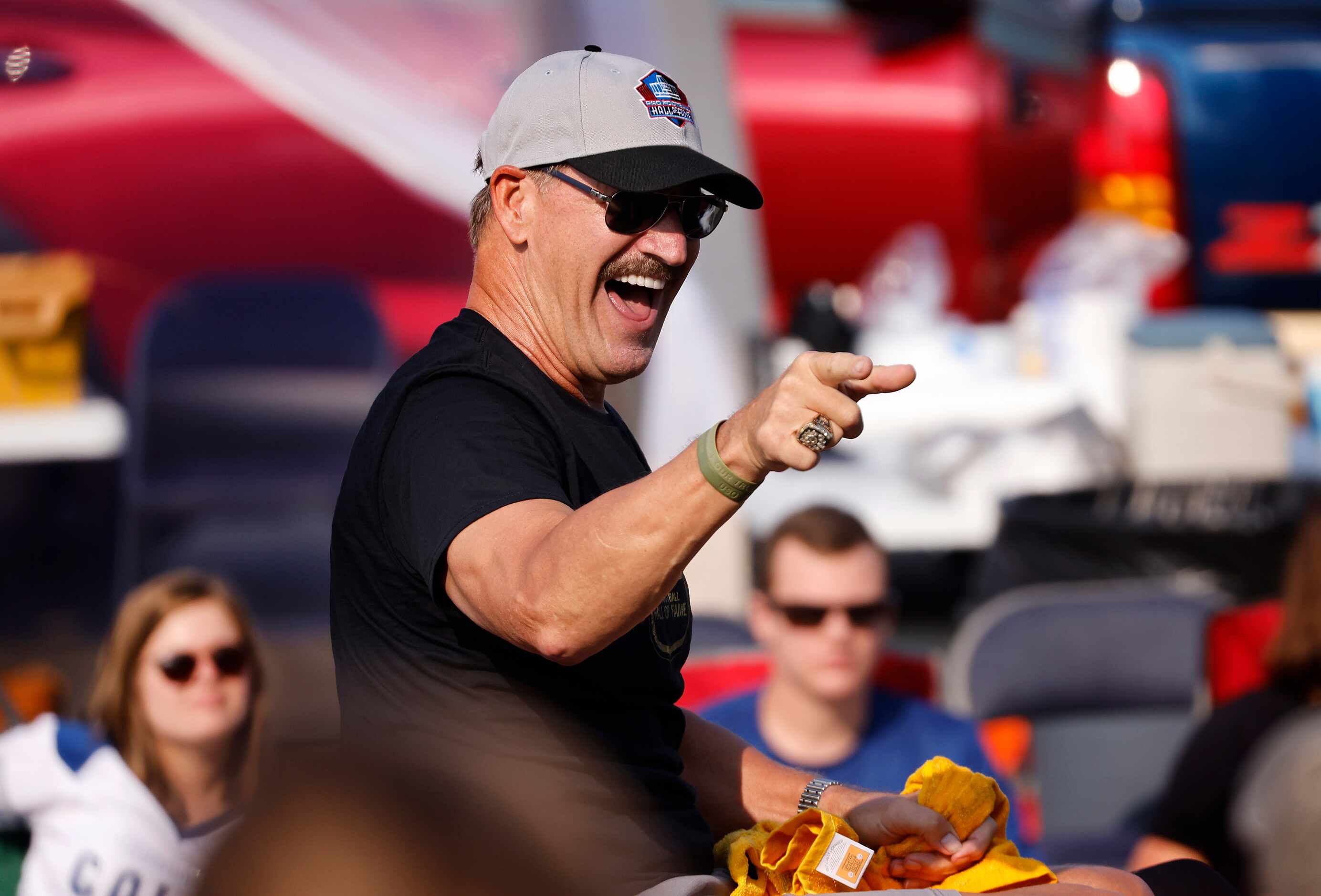 Pittsburgh Steelers Pro Football Hall of Fame inductee Bill Cowher points to his fans as he...