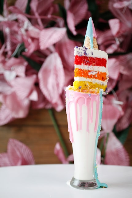 Here's the infamous unicorn milkshake, topped with a slice of cake.