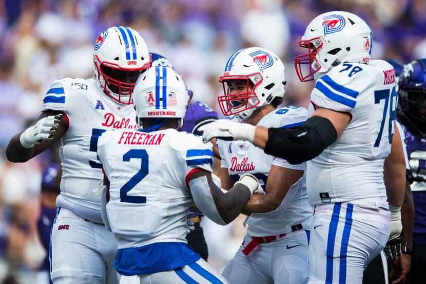 Southern Methodist Mustangs players celebrate a touchdown by Southern Methodist Mustangs...