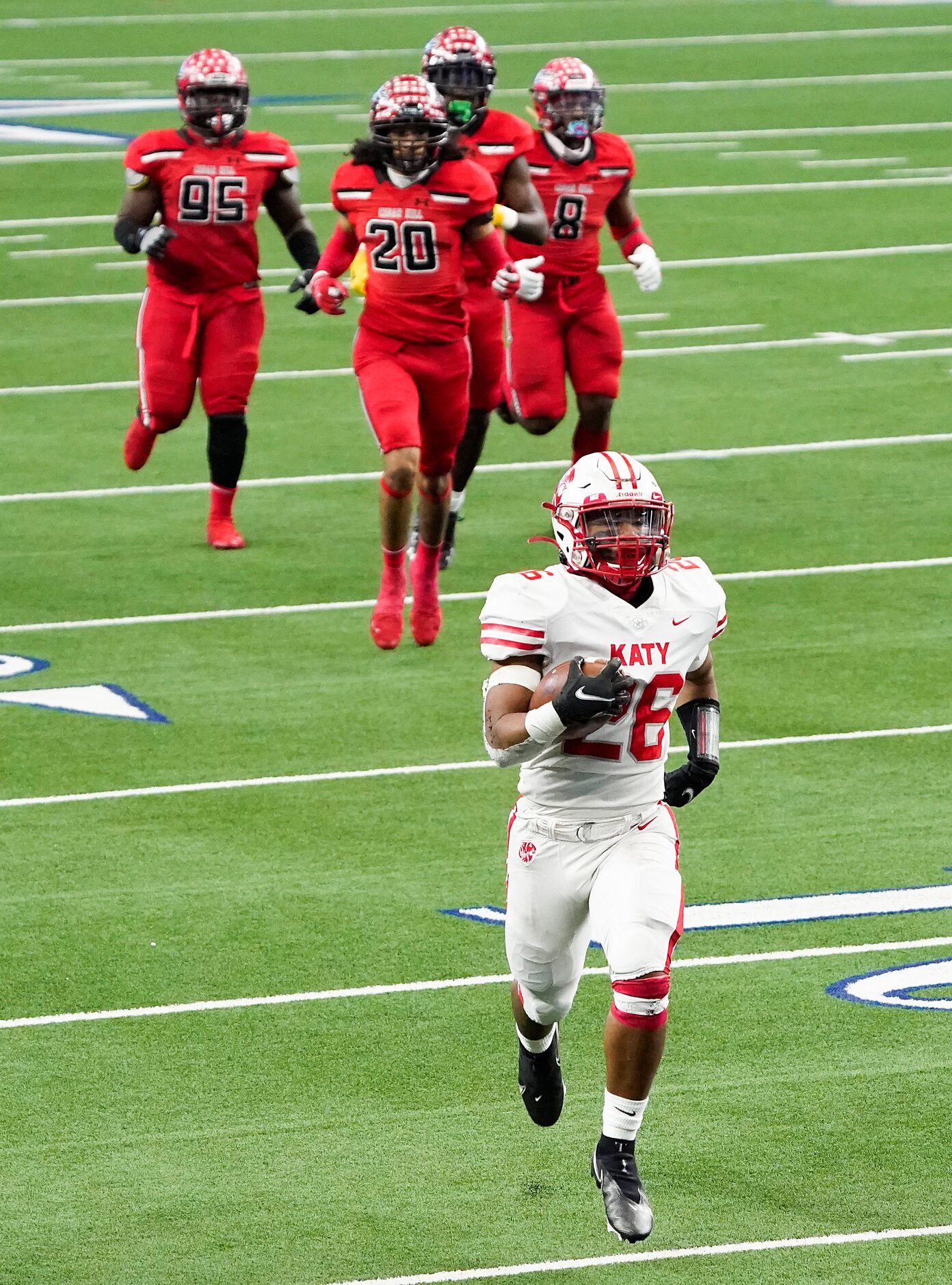 Katy running back Isaiah Smith (26) runs for a 55-yard touchdown leaving Cedar Hill...