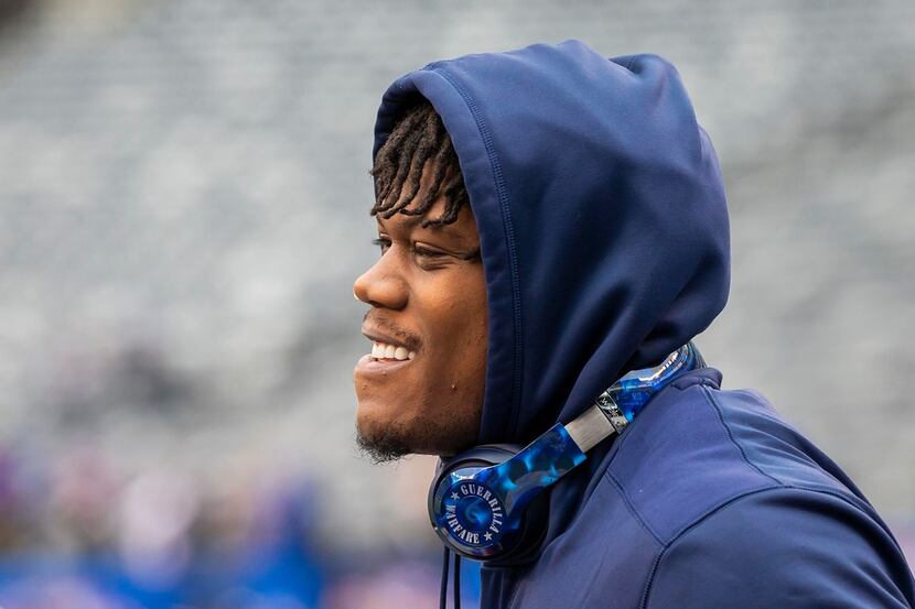 Dallas Cowboys defensive end Randy Gregory warms before an NFL football game against the New...