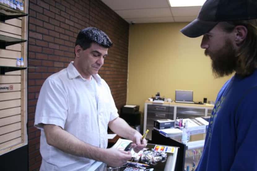 
Malara (left) looks through his inventory with customer Max Gaebler.
