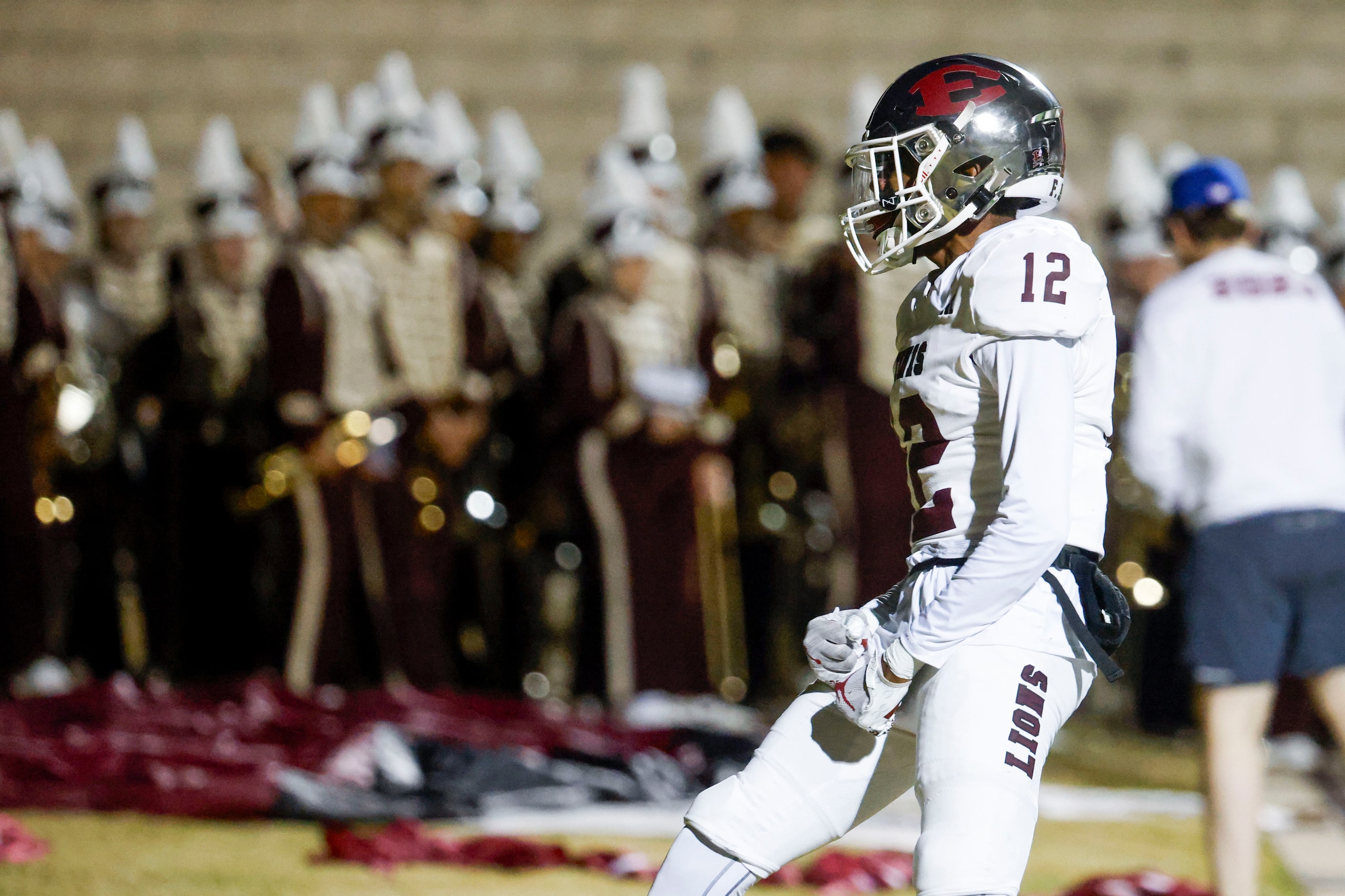 Ennis High’s Taurean Bell (12) celebrates a touchdown against Mansfield Summit high during...