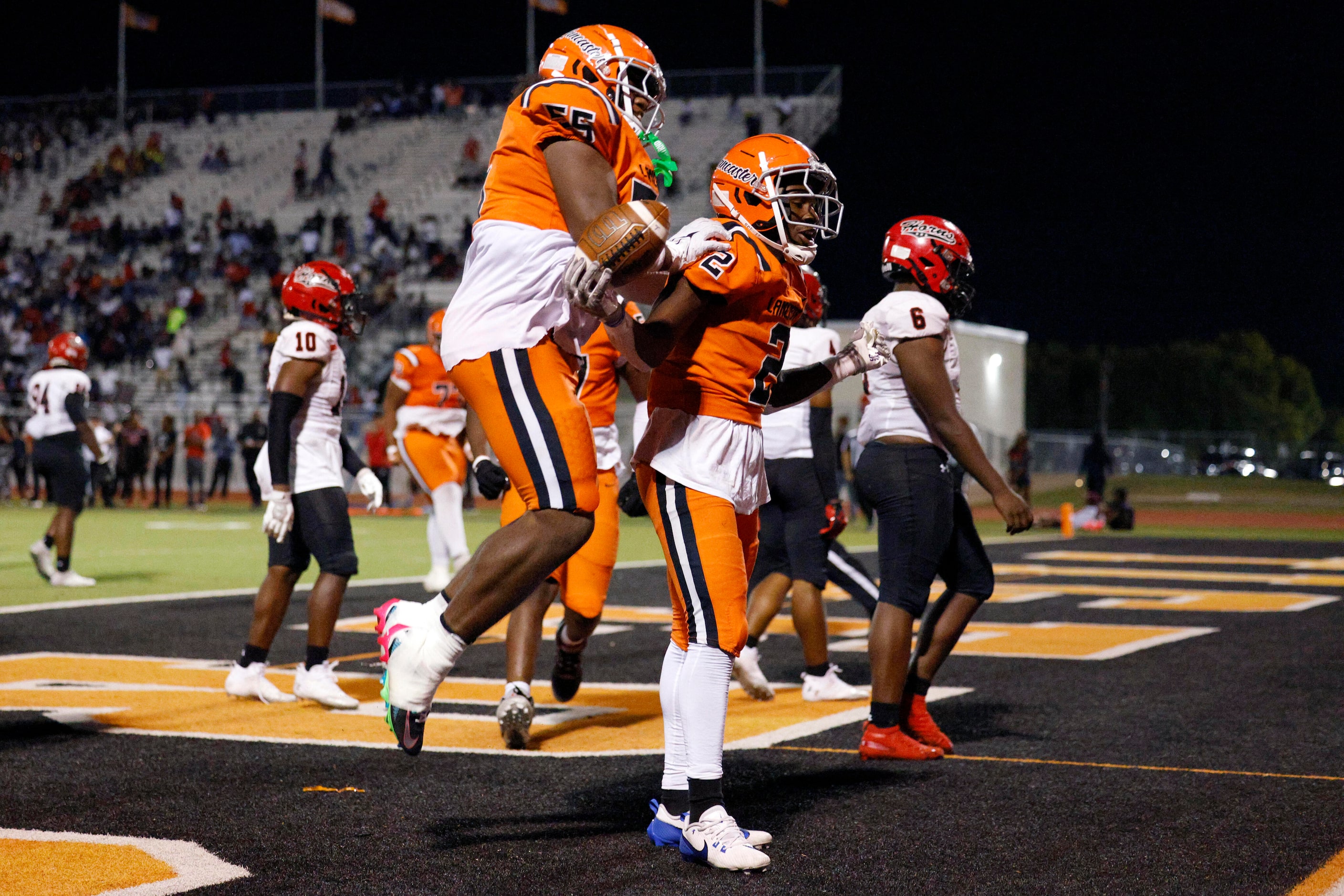 Lancaster running back Izayah Lee (2) celebrates his game-winning touchdown with offensive...