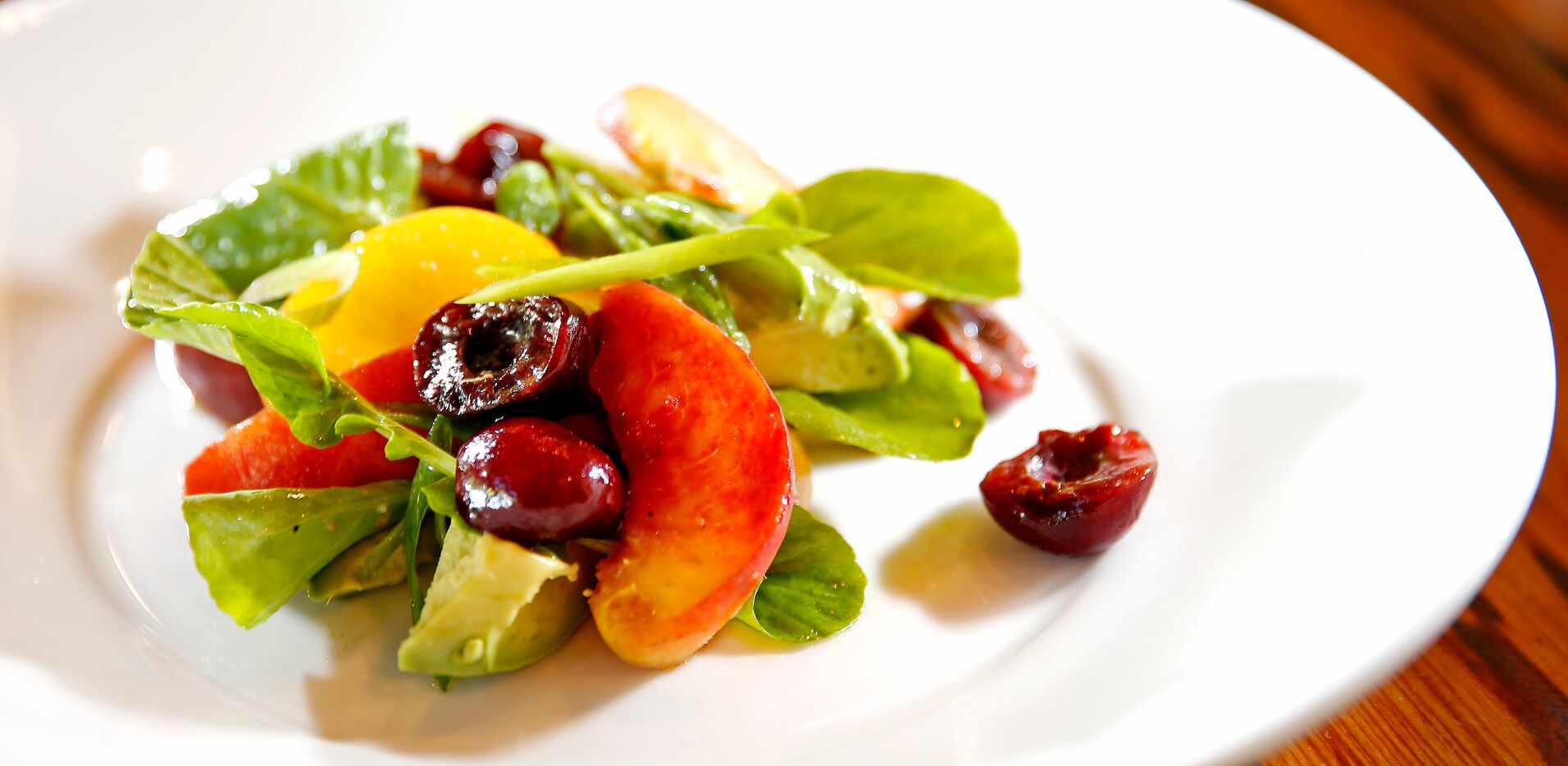 Avocado and Stone Fruit Salad at LARK on the Park restaurant.