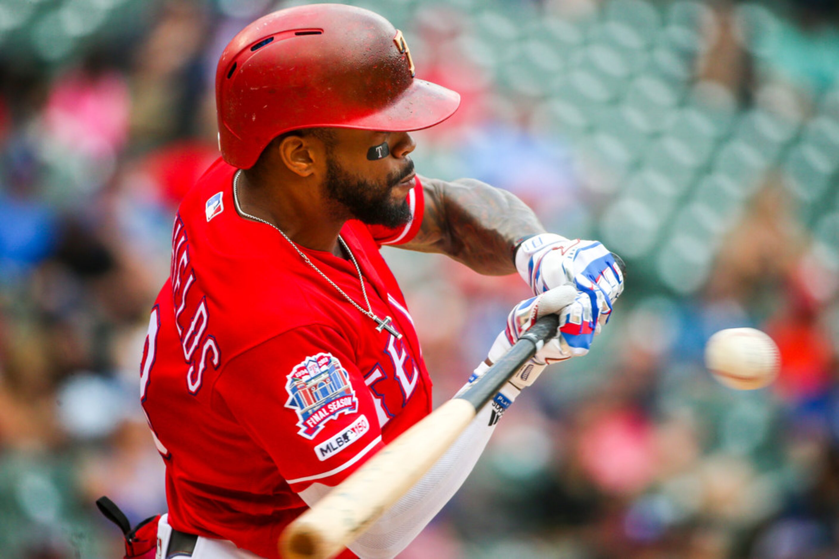 Texas Rangers left fielder Delino DeShields (3) swings at  a pitch during a Major League...