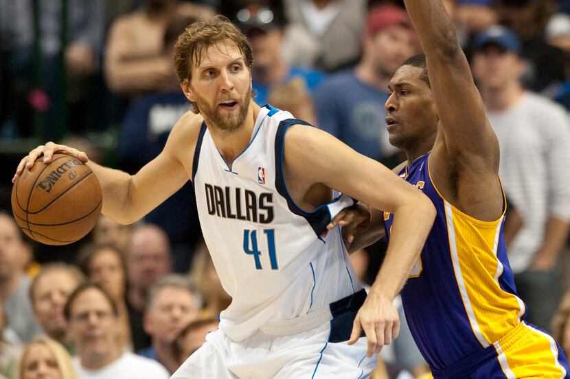 Dirk Nowitzki (41) of the Dallas Mavericks posts up against Metta World Peace (15) of the...