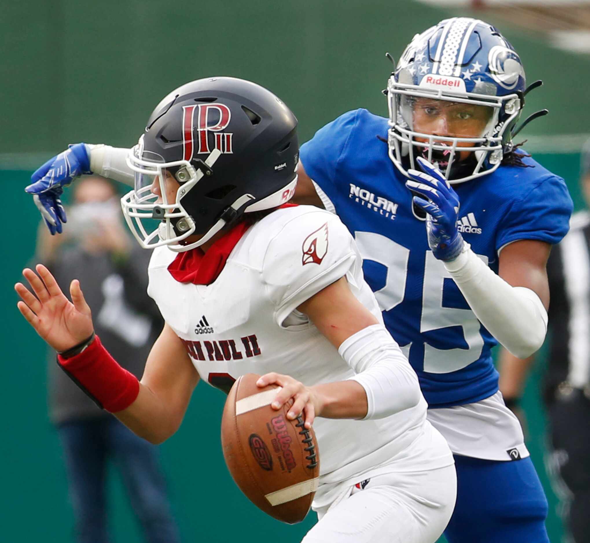 Fort Worth Nolan defensive back Gerald Lacy (25) bears down on Plano John Paul ll...