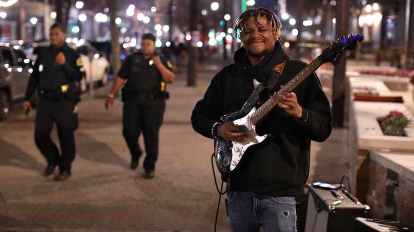 Rickey Mitchell was in a groove playing guitar in Deep Ellum on Dec. 16.