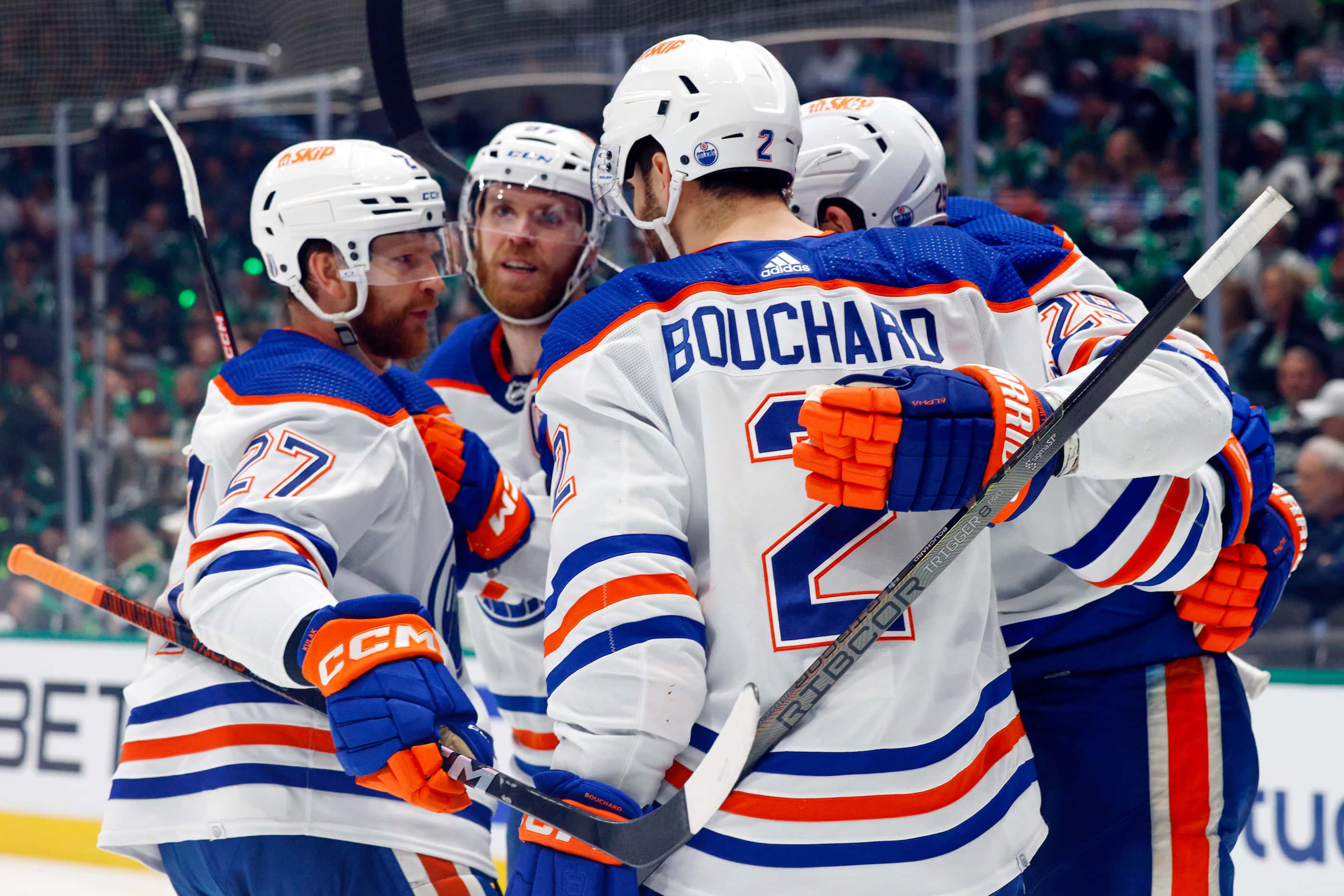 Edmonton Oilers players celebrate after a goal during the second period of Game 1 of the NHL...