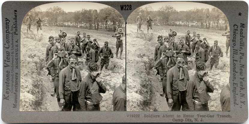 Soldiers preparing to fight in World War I train in a tear gas trench at Camp Dix in...