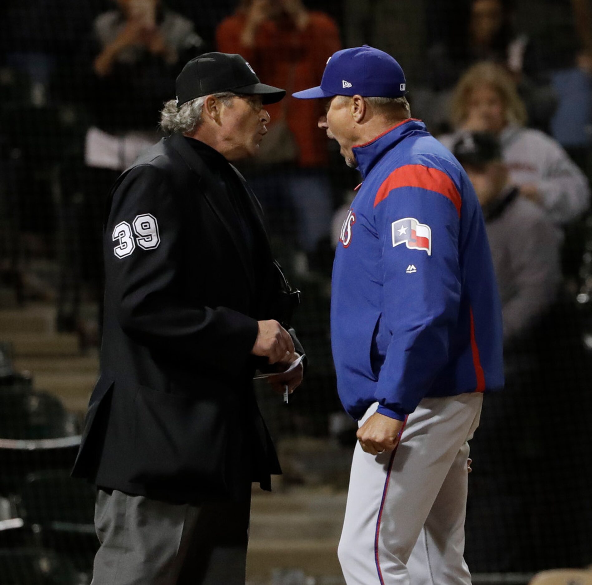 Texas Rangers manager Jeff Banister, right, argues with home plate umpire Paul Nauert during...