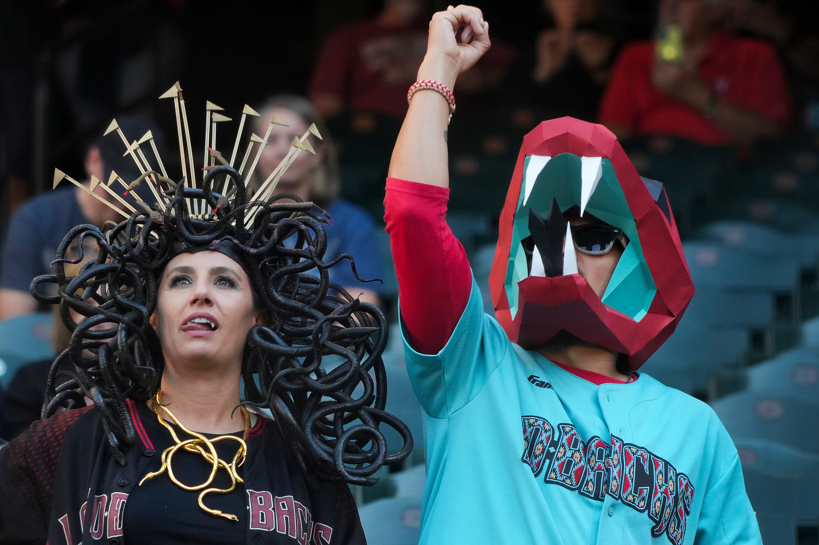 Costumed Arizona Diamondbacks fans watch batting practice before Game 4 of the World Series...