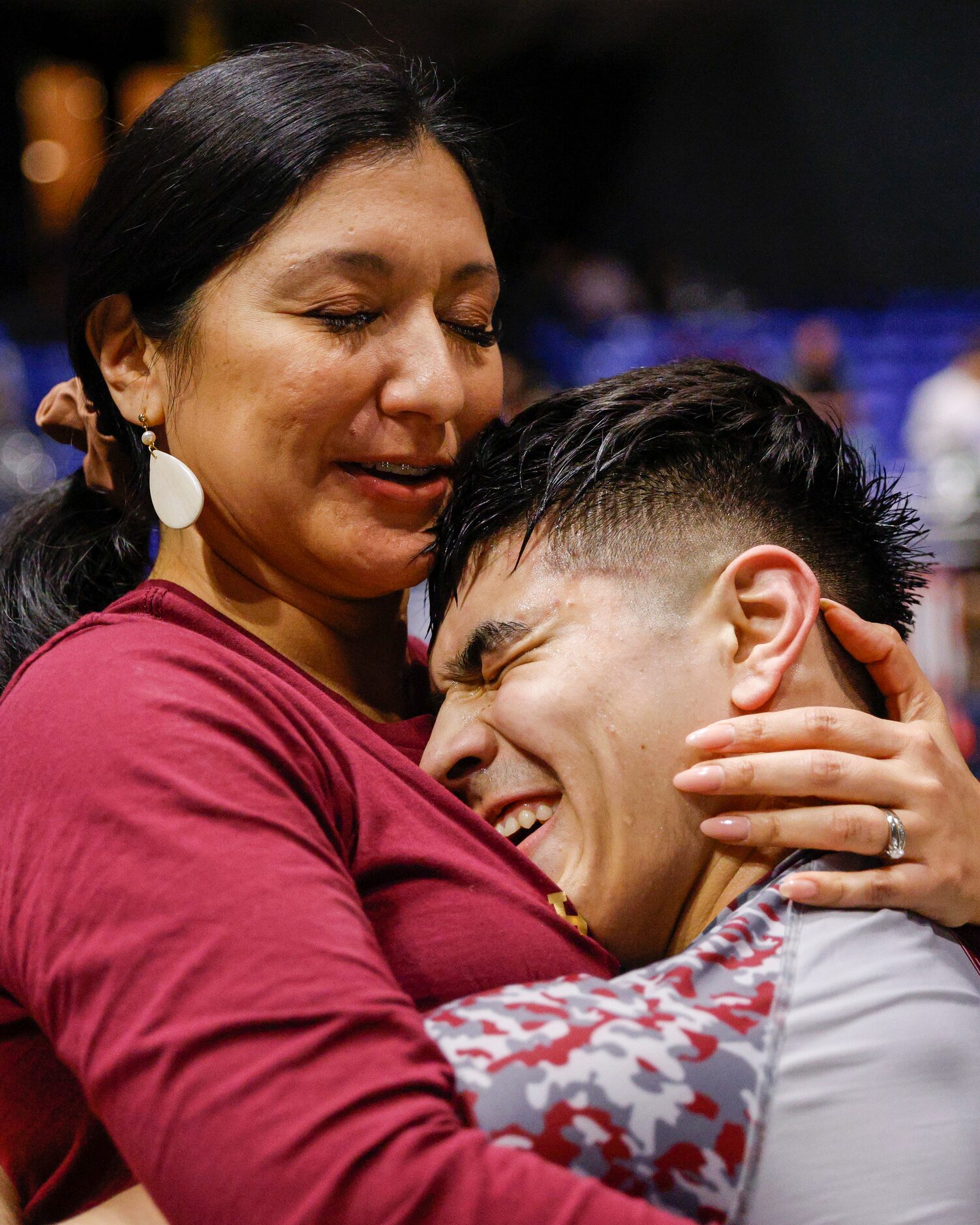 Alex Zavala (right) hugs his mother Jessica Zavala after winning the 5A boys 195-pound UIL...