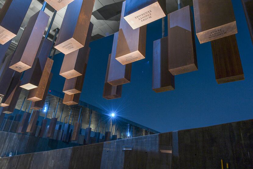 Names and dates of lynching victims are inscribed on Corten steel monuments at the National...