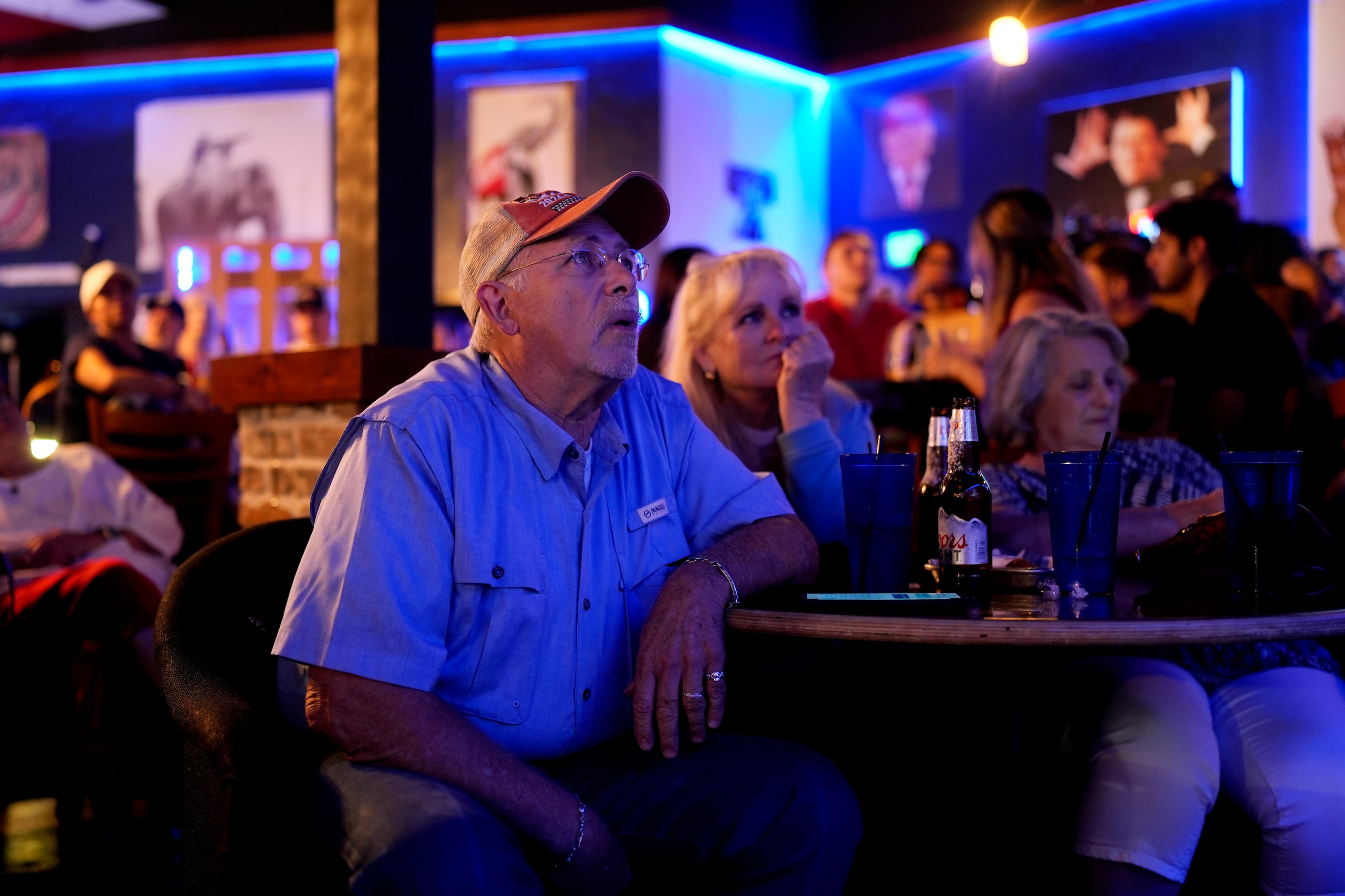 C.W. Barnum joins others to watch the presidential debate between Republican presidential...