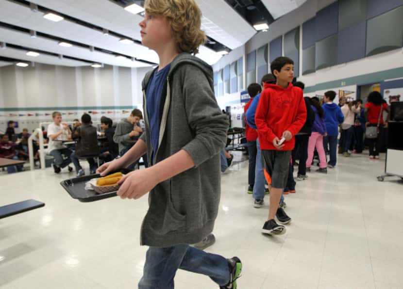 Students headed to lunch tables filled with their friends at Staley Middle School in Frisco.