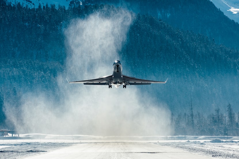 Corporate Jet taking off in the snow.