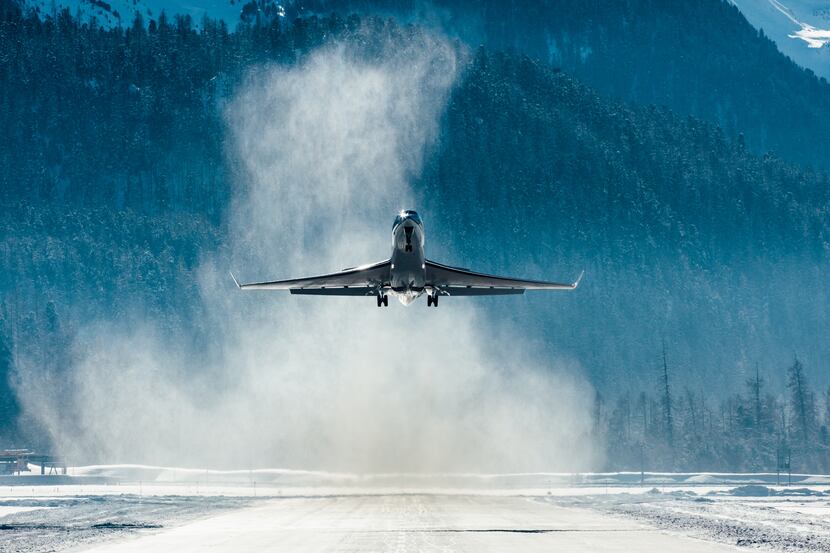 Corporate Jet taking off in the snow.