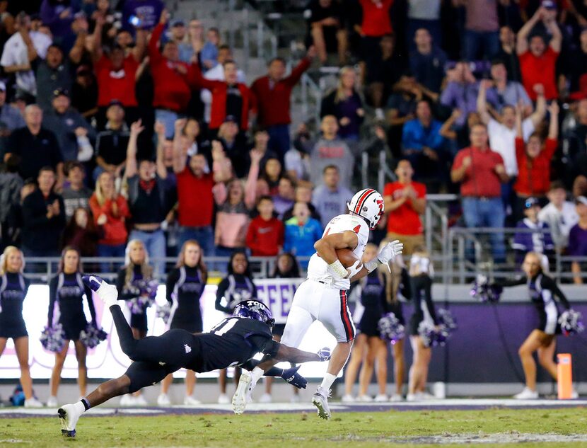 TCU Horned Frogs safety Ridwan Issahaku (31) can't get a grasp of Texas Tech Red Raiders...