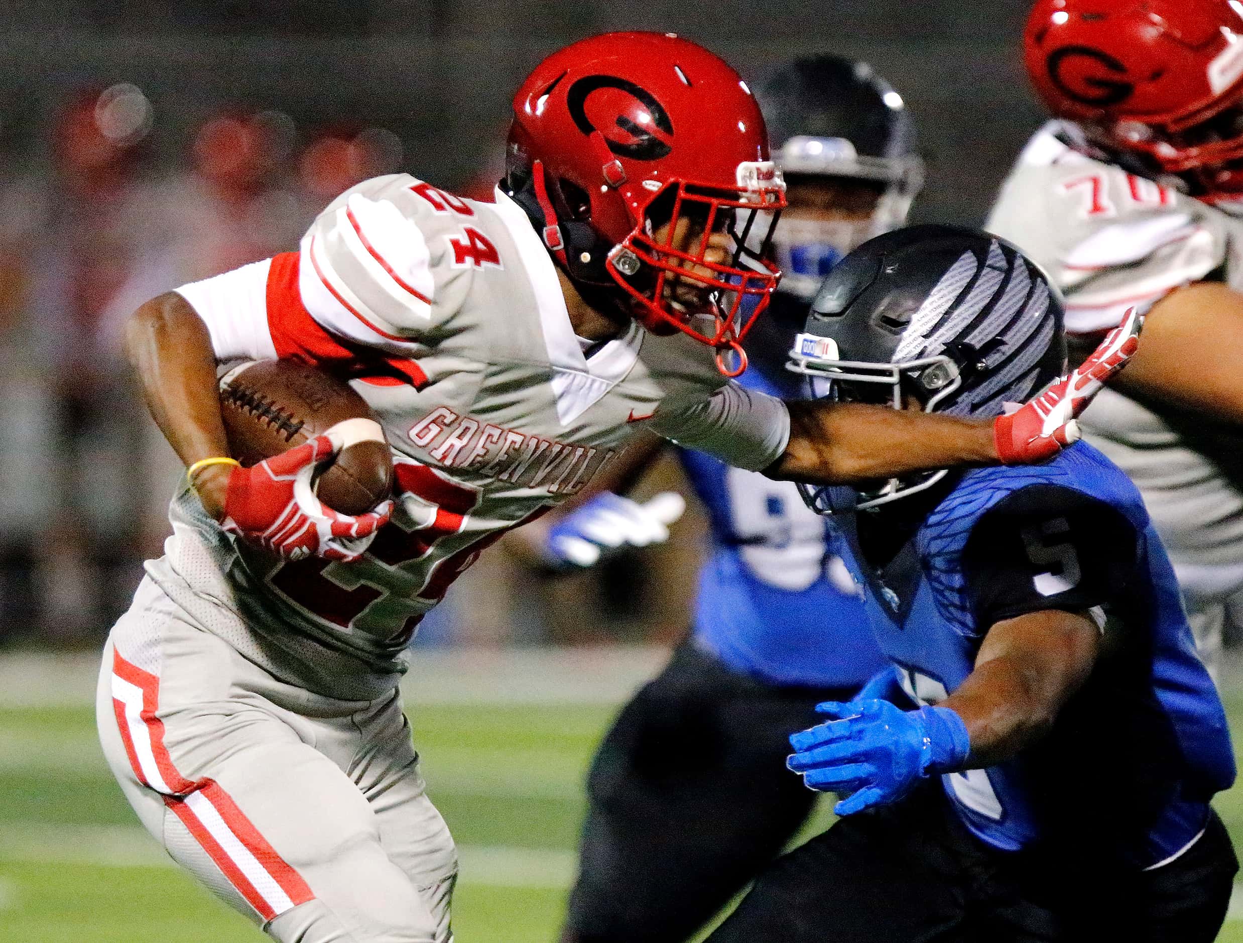 Greenville High School running back Hugh Pitts (24) carries the football during the first...