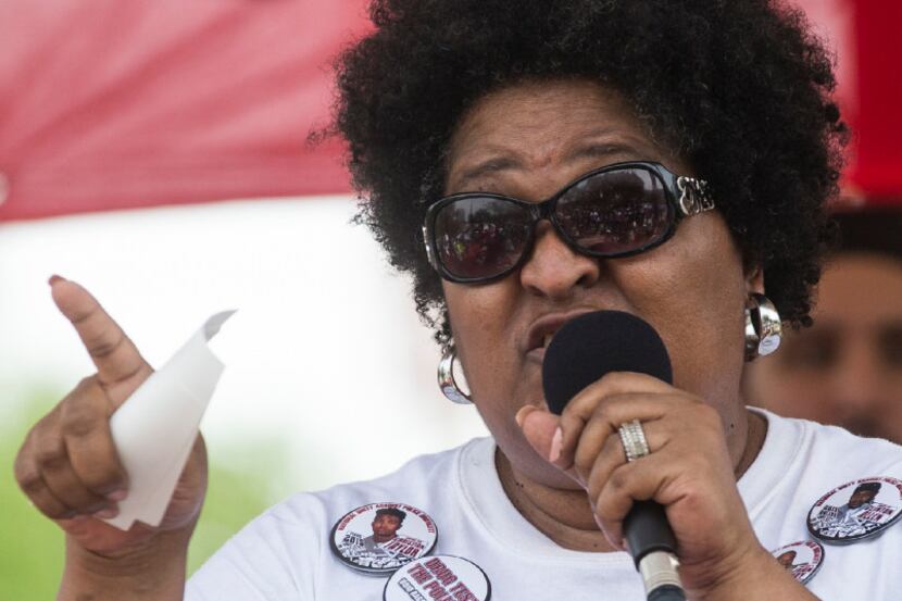 Collette Flanagan speaks at a rally in Pike Park following the "March to End Police...