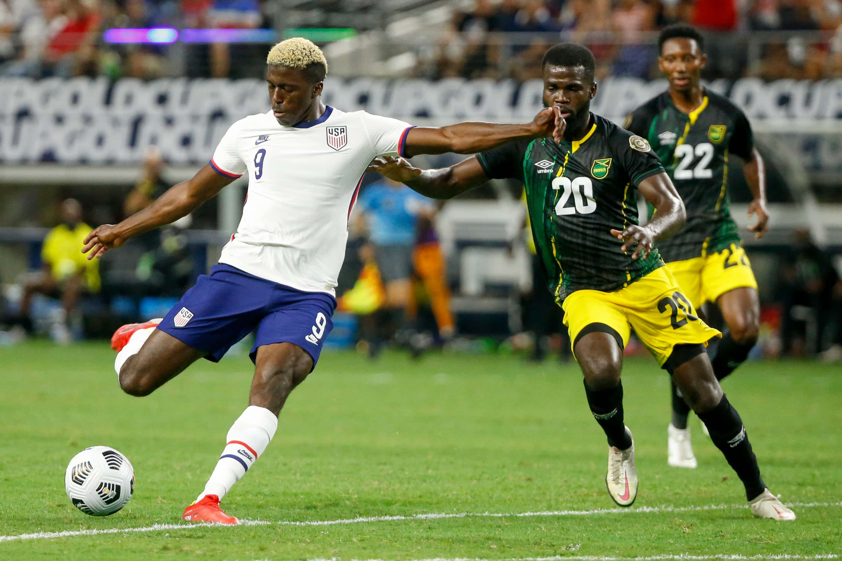 USA forward Gyasi Zardes (9) shoots the ball ahead of Jamaica defender Kemar Lawrence (20)...