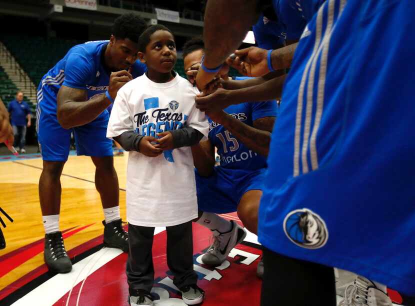 A youngster had his shirt signed by players during Legends Fan Jam at Dr Pepper Arena.