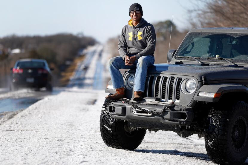 North Texas Jeep Club member Leonard Fleming poses for a photo on his Jeep Gladiator in...