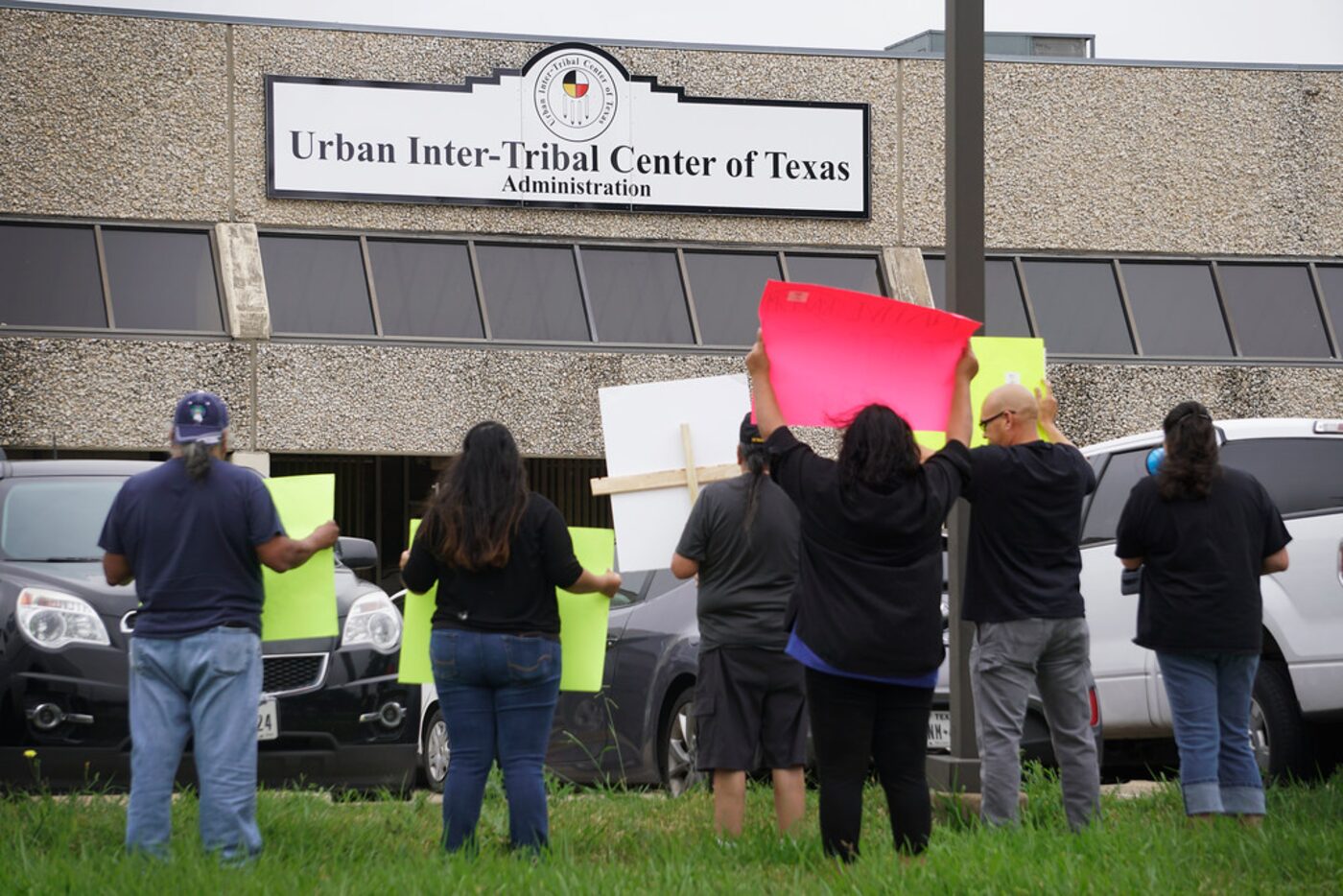 A small group of protesters demonstrated after three employees say they were fired from the...