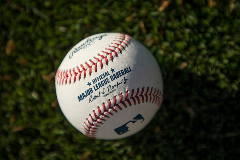 FILE - Detail photo of an official MLB baseball at the Texas Rangers spring training...
