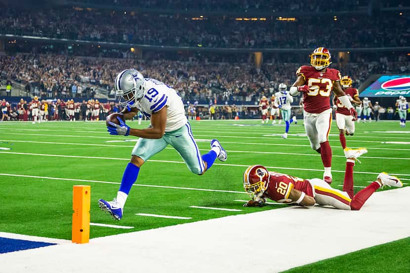 Dallas Cowboys wide receiver Amari Cooper (19) scores past Washington Redskins strong safety...
