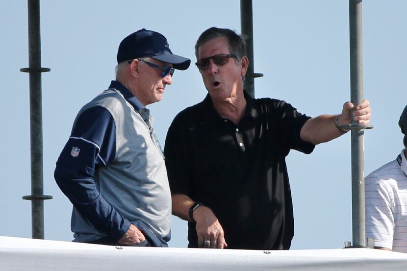 Dallas Cowboys owner and general manager talks with former Dallas Cowboys coach Norv Turner...