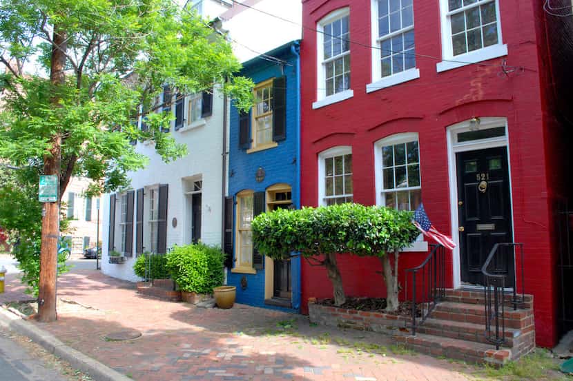 The electric blue Spite House is the skinniest historic home in America, at just 7 feet...