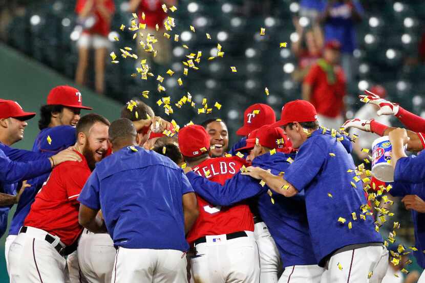 The Rangers celebrate their 3-2 win during the Los Angeles Angels vs. the Texas Rangers...