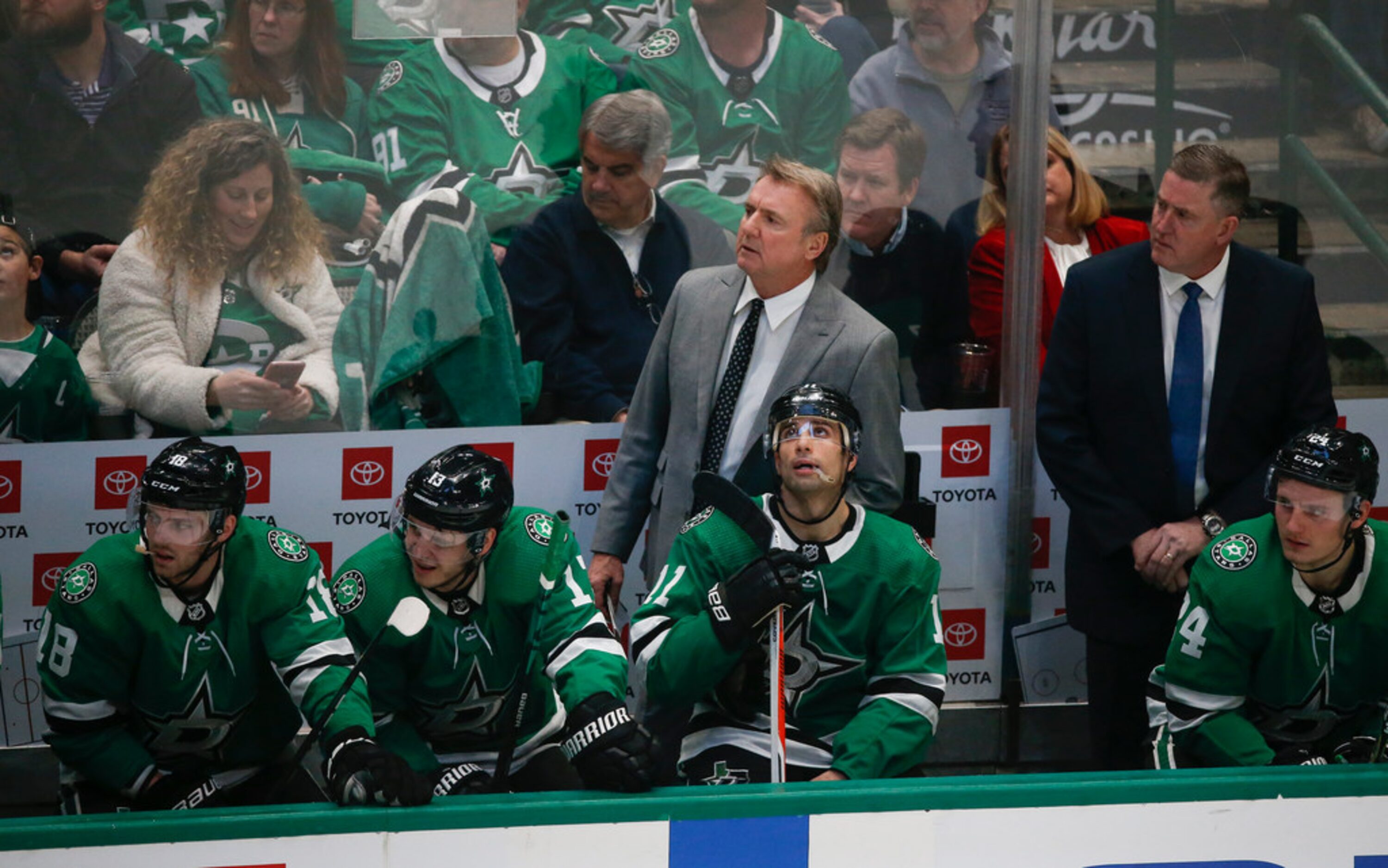 Dallas Stars interim head coach Rick Bowness, left, works the bench alongside Assistant...