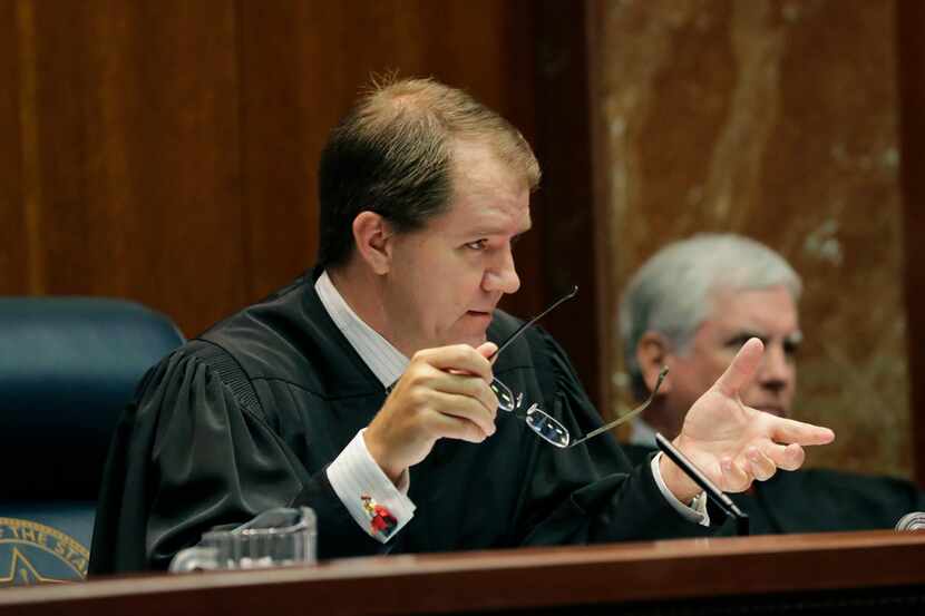 Texas Supreme Court Justice Don Willett asks a question during oral arguments. President...