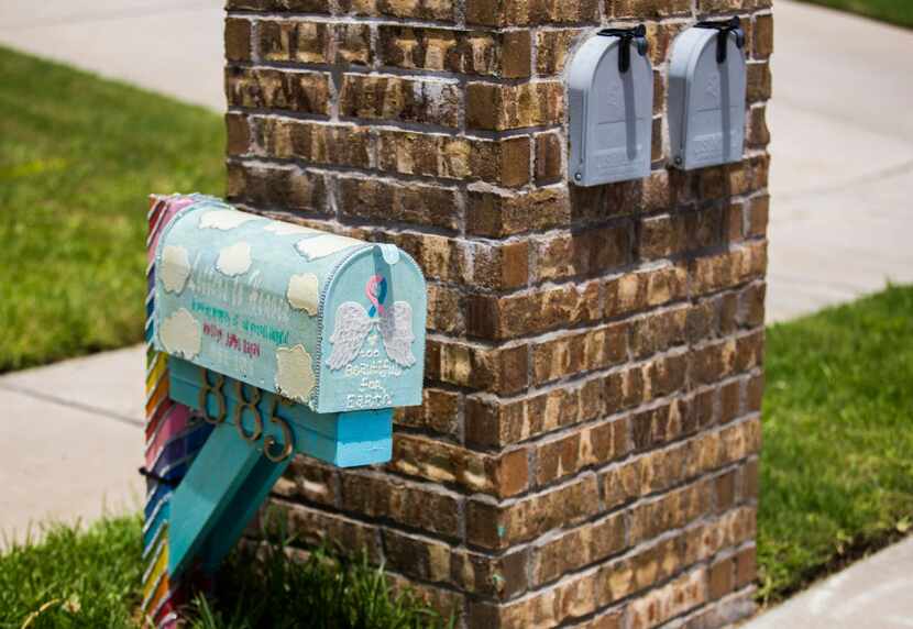 A handmade mailbox in honor of Anistyn Ragan, who died suddenly in December, stands next to...