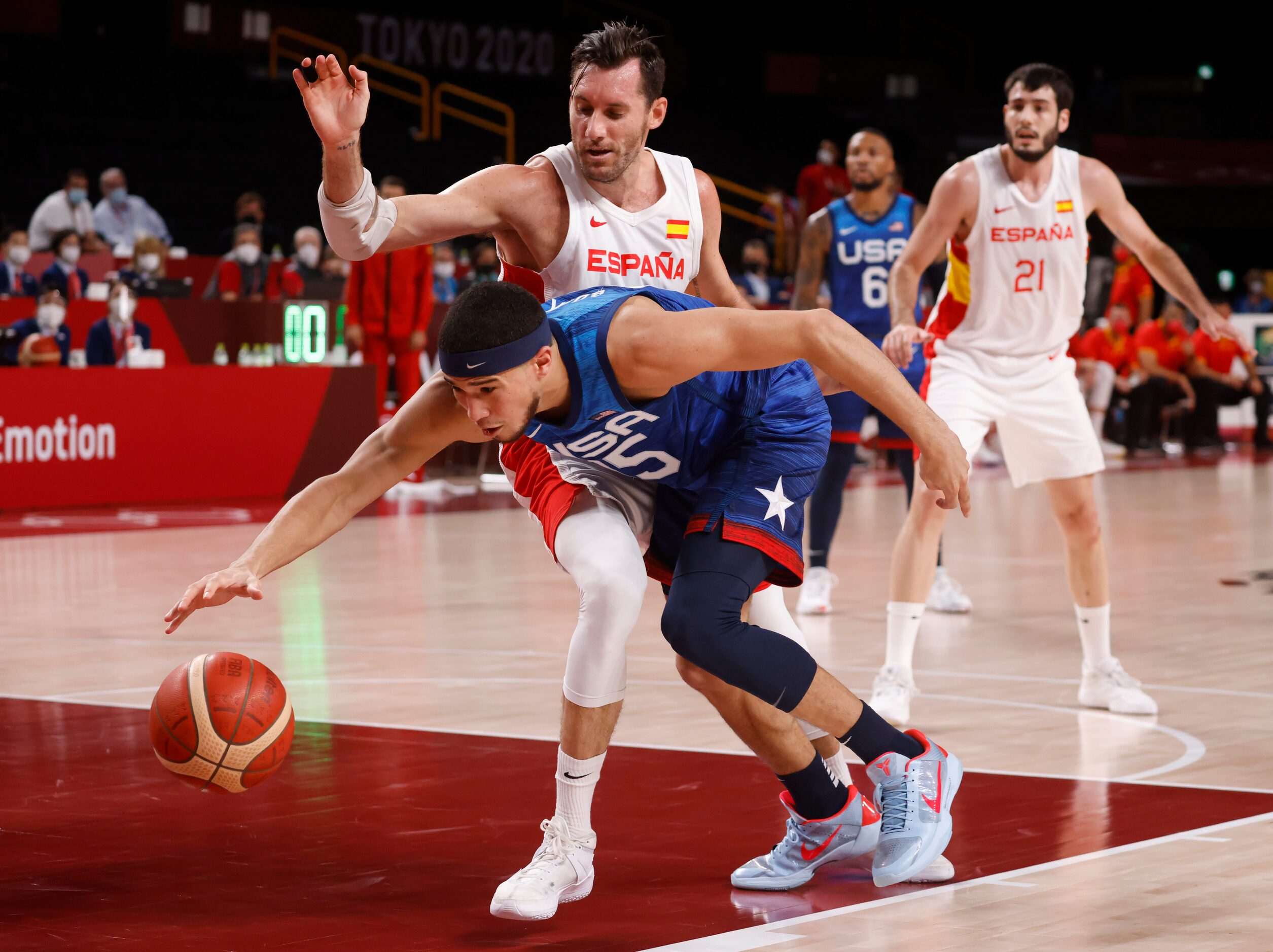 USA’s Devin Booker (15) attempts to dribble around Spain’s  Rudy Fernandez (5) during the...