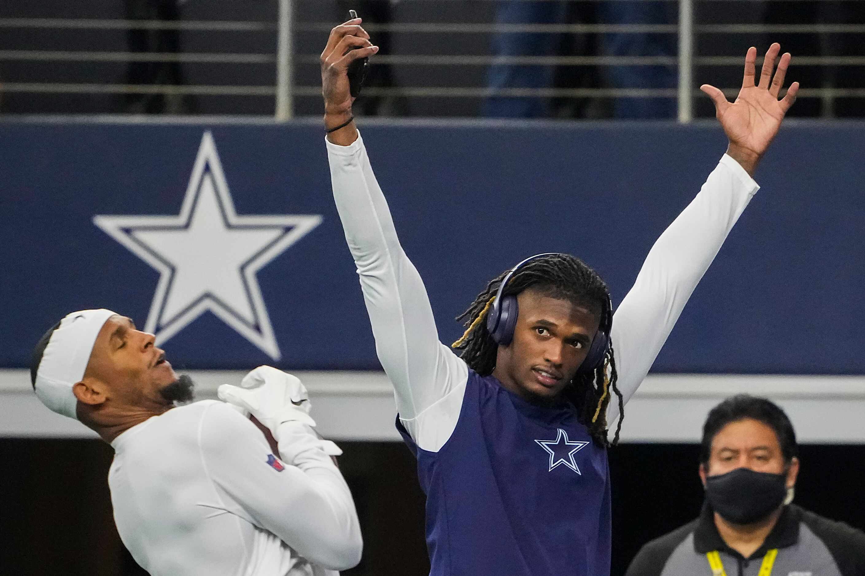Dallas Cowboys wide receiver CeeDee Lamb cheers a catch by wide receiver Ced Wilson at the...