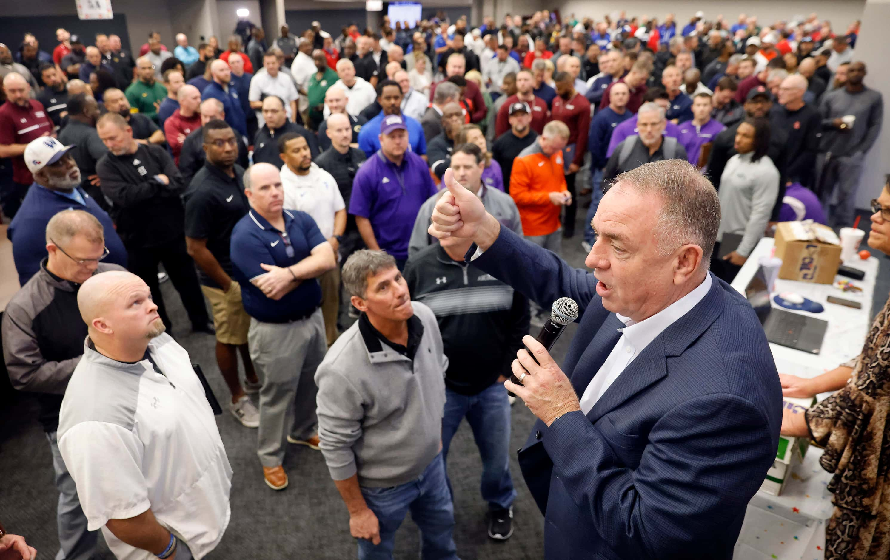 Birdville ISD Athletic Director Barry Norton gives instruction to high school coaches and...