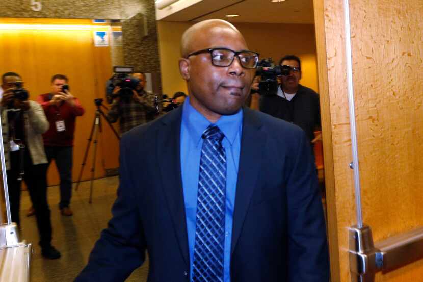 Former Farmers Branch police officer Ken Johnson enters the courtroom in the Frank Crowley...