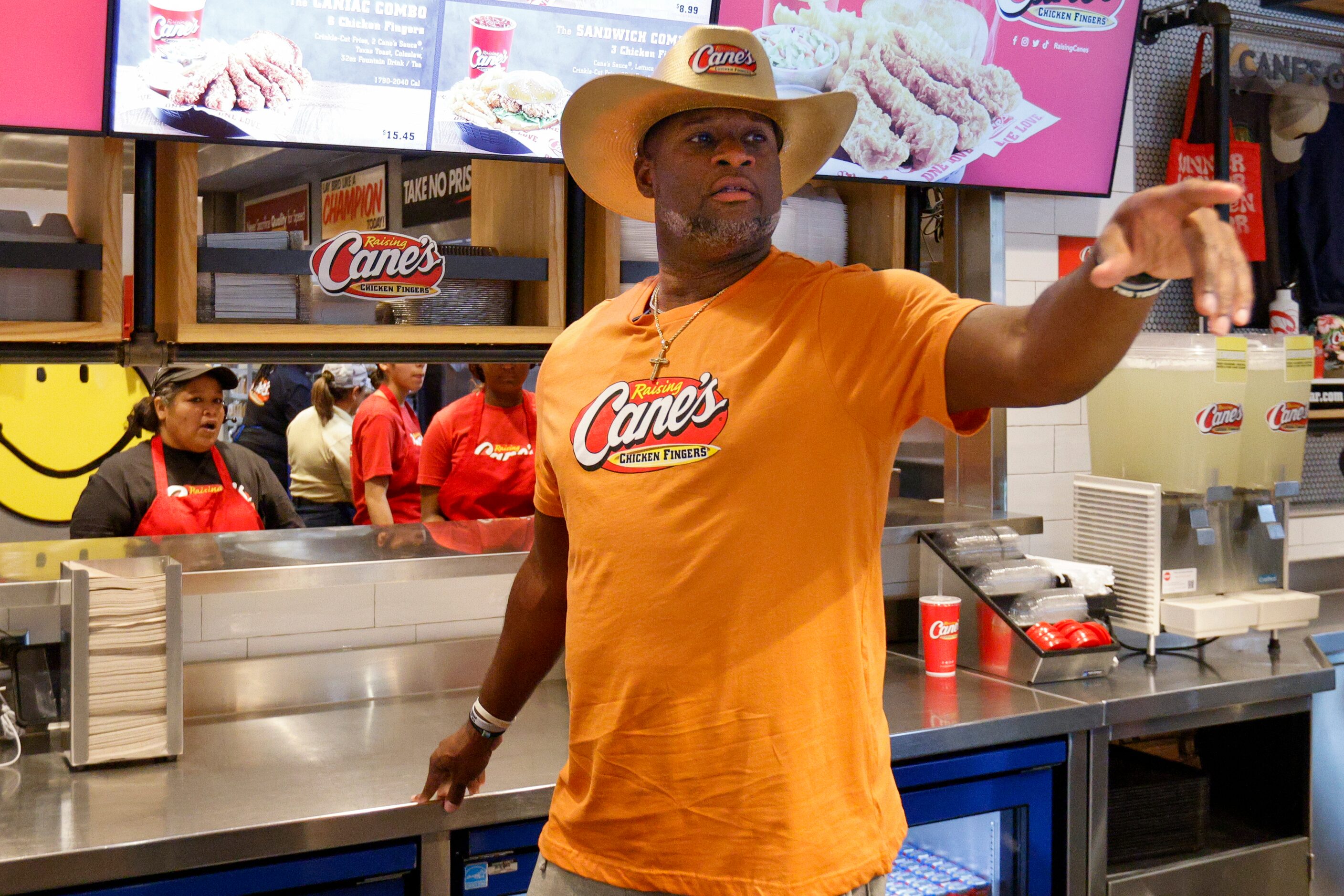 Former Texas quarterback Vince Young calls out an order while working behind the counter at...