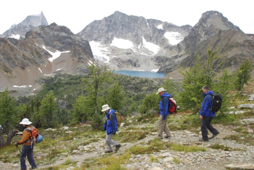 Hikers pass Cobalt Lake in Bugaboo Provincial Park. There are hikes to accommodate different...