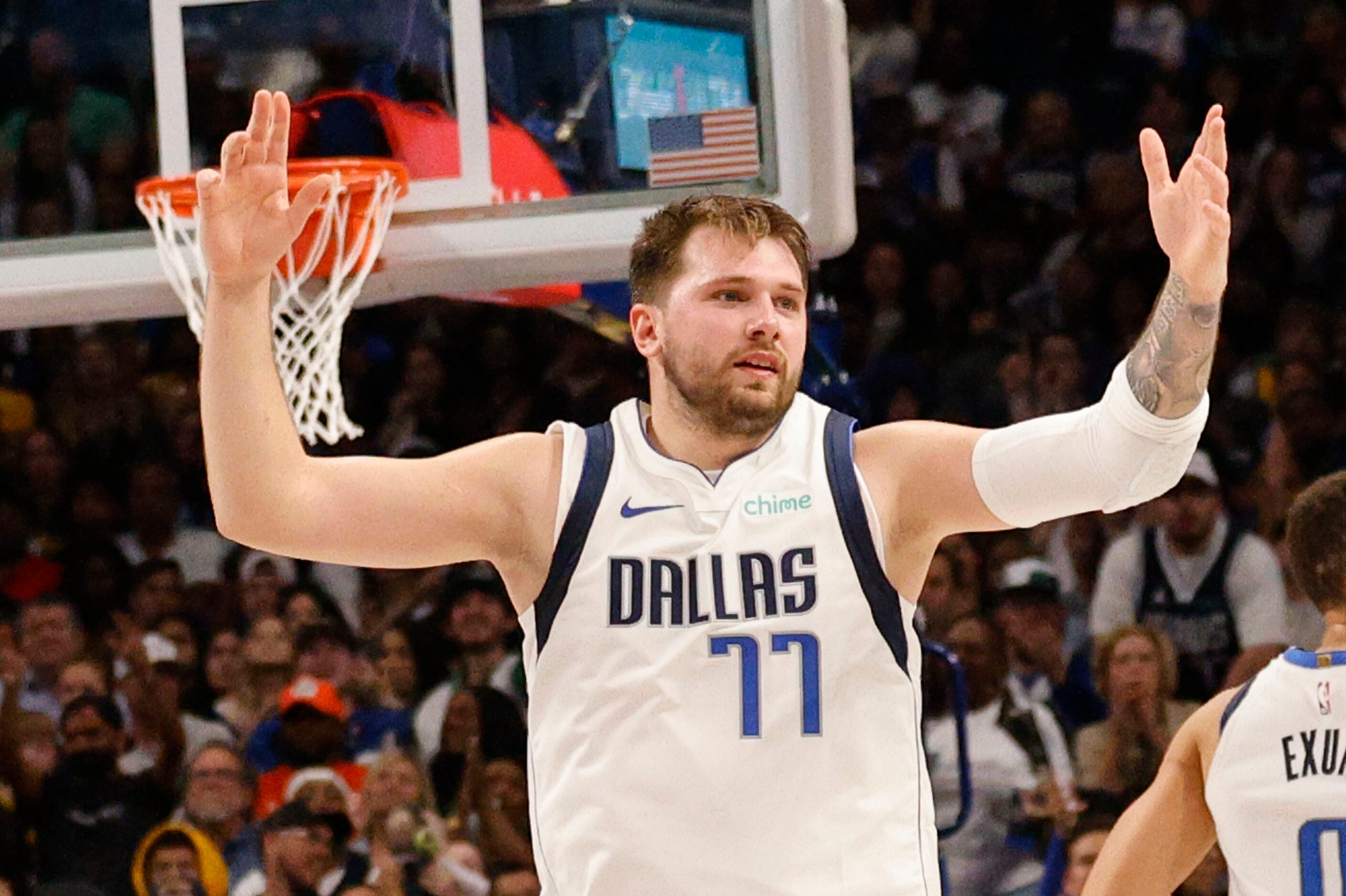 Dallas Mavericks guard Luka Doncic (77) reacts after he scored during the second half of an...