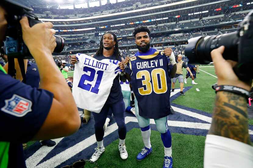 FILE - Dallas Cowboys running back Ezekiel Elliott (21) and Los Angeles Rams running back...