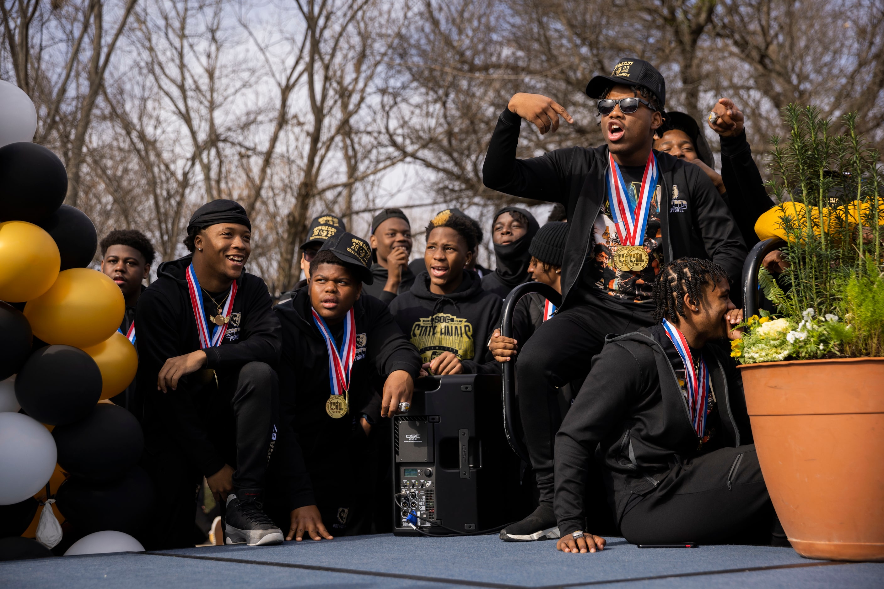 The South Oak Cliff Golden Bears defensive back David “Davo” Spruiells (right) cheers during...